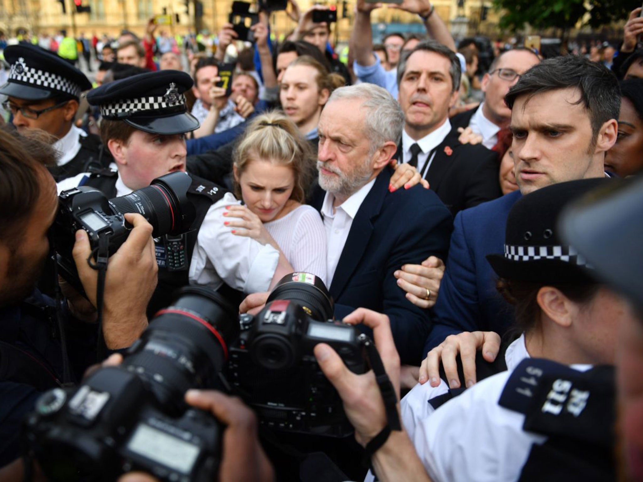 Jeremy Corbyn makes his way through the crowd to delvier a speech during Momentum's 'Keep Corbyn' rally