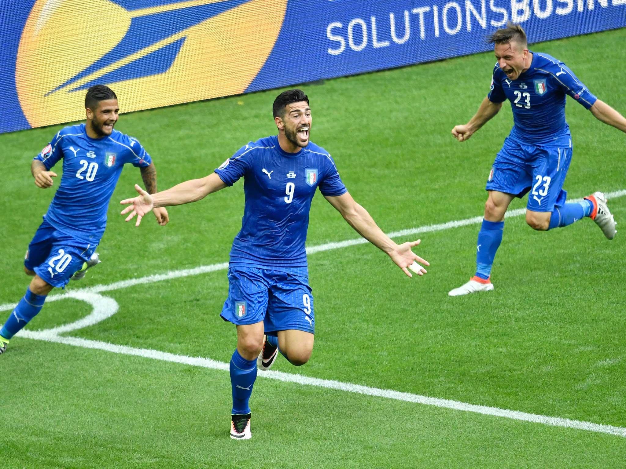 Graziano Pelle wheels away delighted after scoring Italy's second