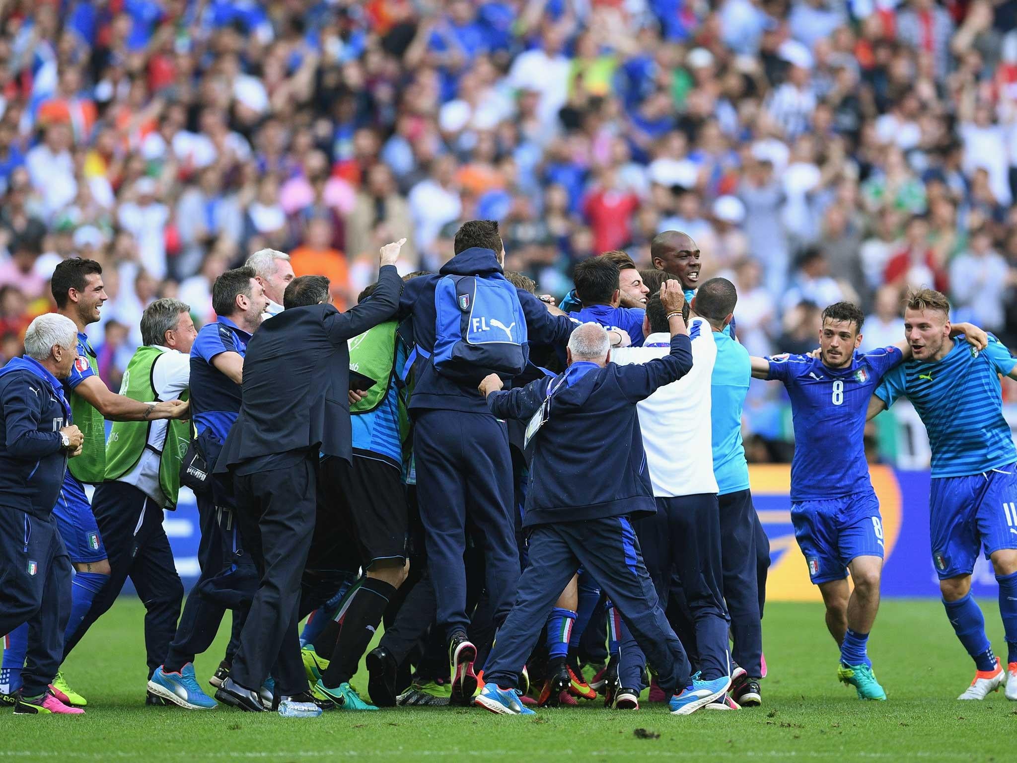 Antonio Conte is mobbed by his players at full-time