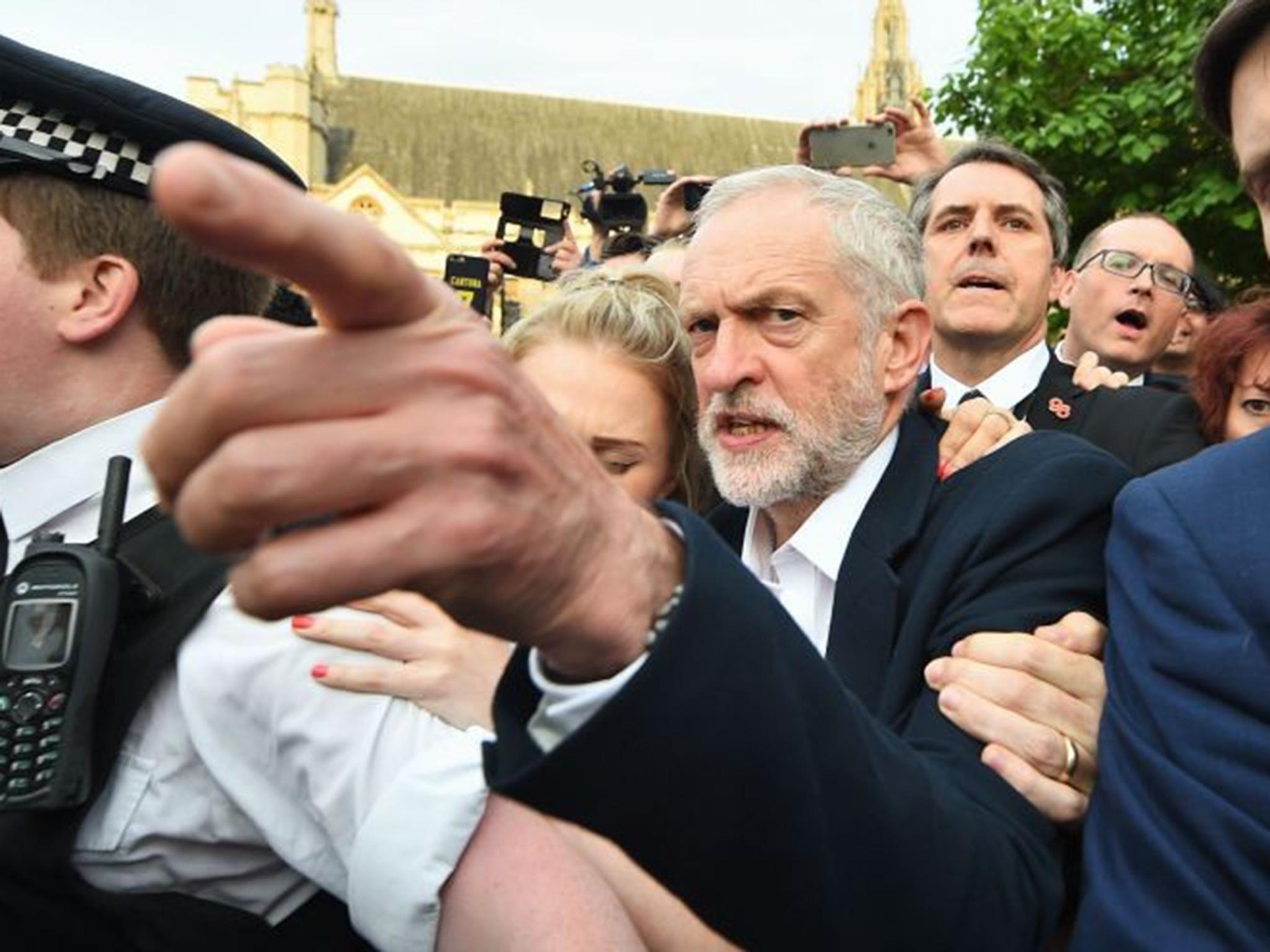 Jeremy Corbyn makes his way from the Parliamentary Labour Party meeting last night to a rally in Parliament Square