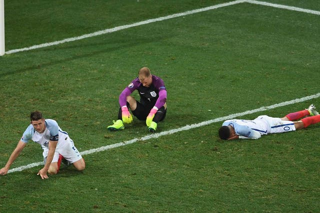 England's players slump to the turf at full-time