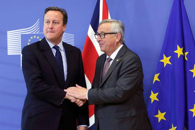 David Cameron is welcomed by European Commission President Jean-Claude Juncker prior to a meeting in Brussels