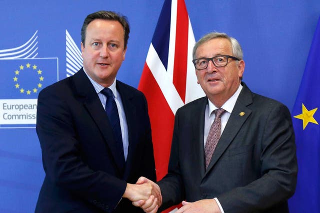 David Cameron shakes hands with European Commission President Jean-Claude Juncker as they arrives at the EU Summit in Brussels