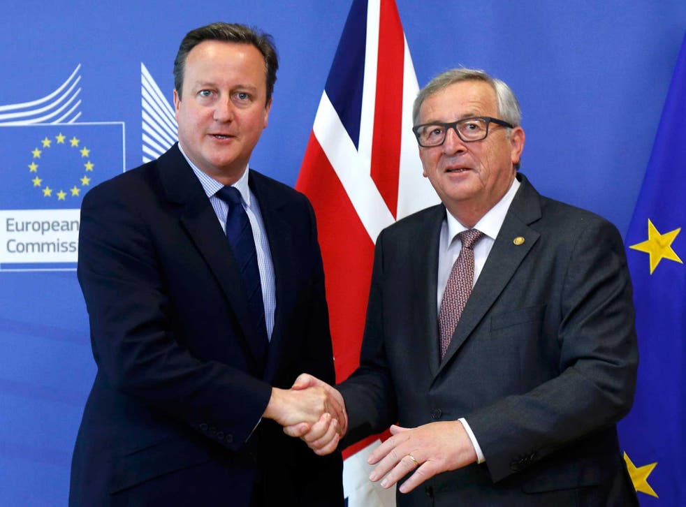 David Cameron shakes hands with European Commission President Jean-Claude Juncker as they arrives at the EU Summit in Brussels