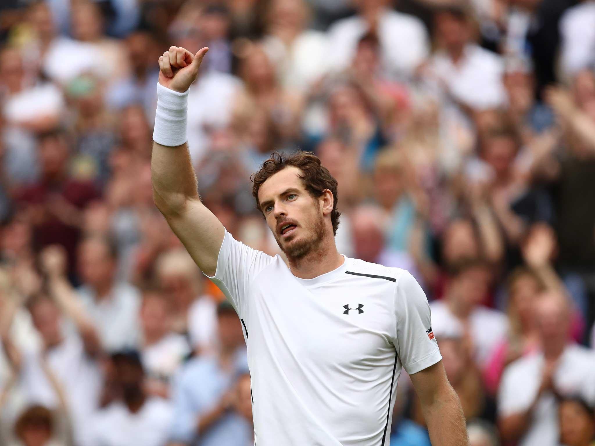 Andy Murray celebrates on Centre Court after getting off to a winning start at this year's Wimbledon
