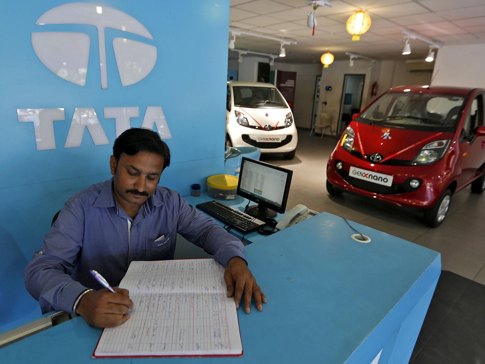 An employee in the Tata Motors car showroom in Ahmedabad, India, last year