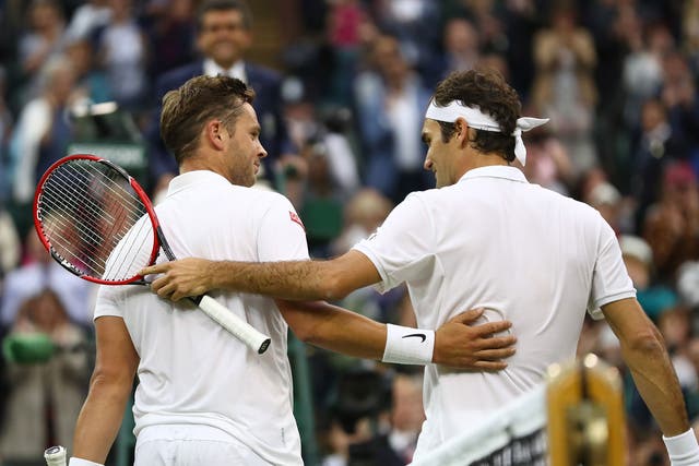 Marcus Willis and Roger Federer exchange words at the end of the Centre Court match