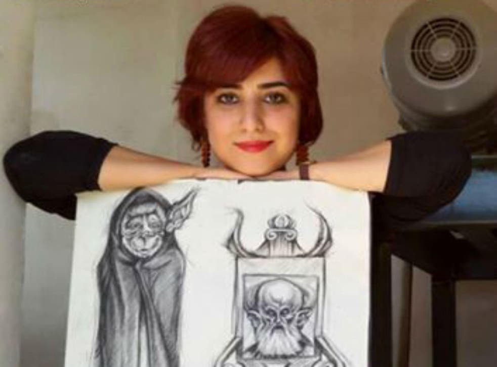 Atena Farghadani with the new cartoon she published in June