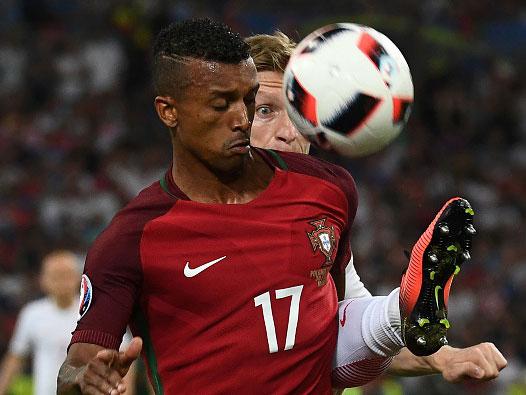 Jakub Blaszczykowski challenges Nani for the ball, but which player earned top marks? (Getty)