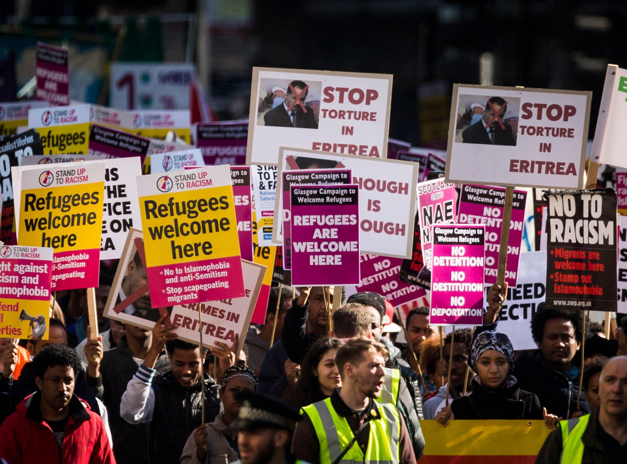 Campaigners from Stand Up to Racism protest through Glasgow City Centre March 19