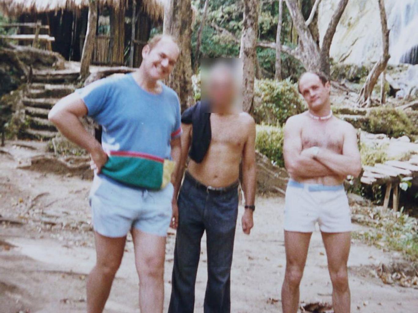 Douglas Slade, left, pictured in the Philippines with fellow Paedophile Information Exchange member Christopher Skeaping, right