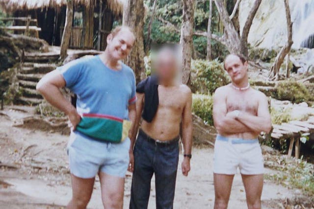 Douglas Slade, left, pictured in the Philippines with fellow Paedophile Information Exchange member Christopher Skeaping, right