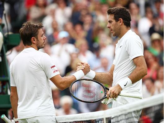 Juan Martin del Potro commiserates with Stan Wawrinka at the net (Getty)