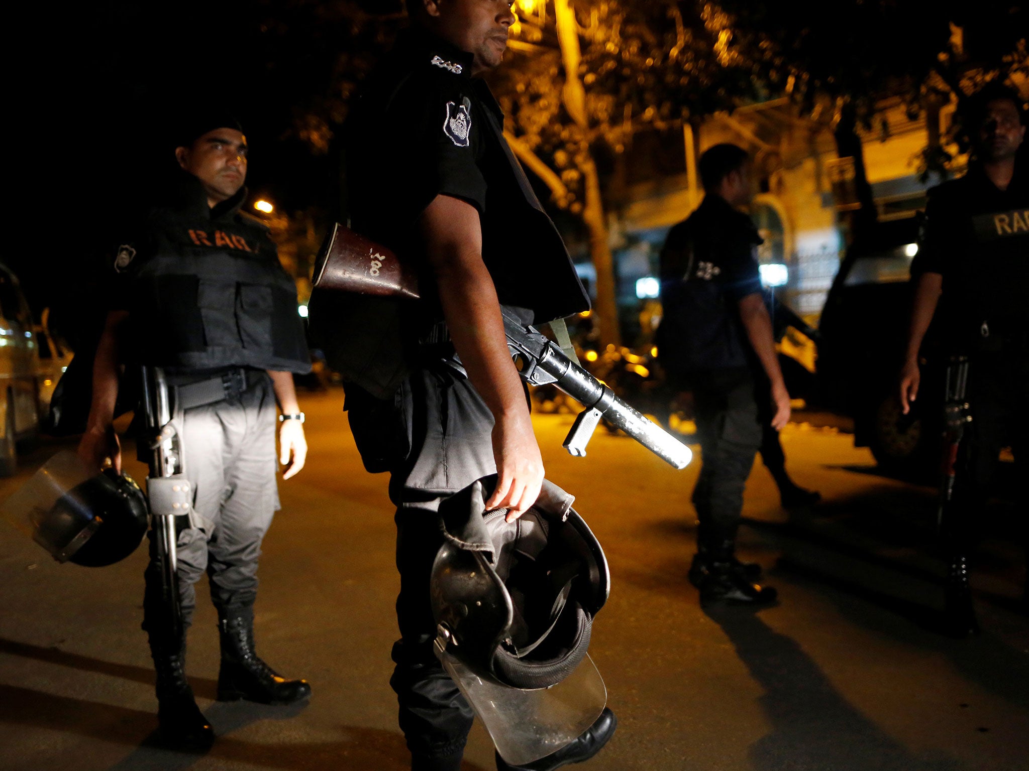 Security personnel keep watch, after gunmen stormed the Holey Artisan restaurant and took hostages, in the Gulshan area of Dhaka, Bangladesh July 2, 2016.