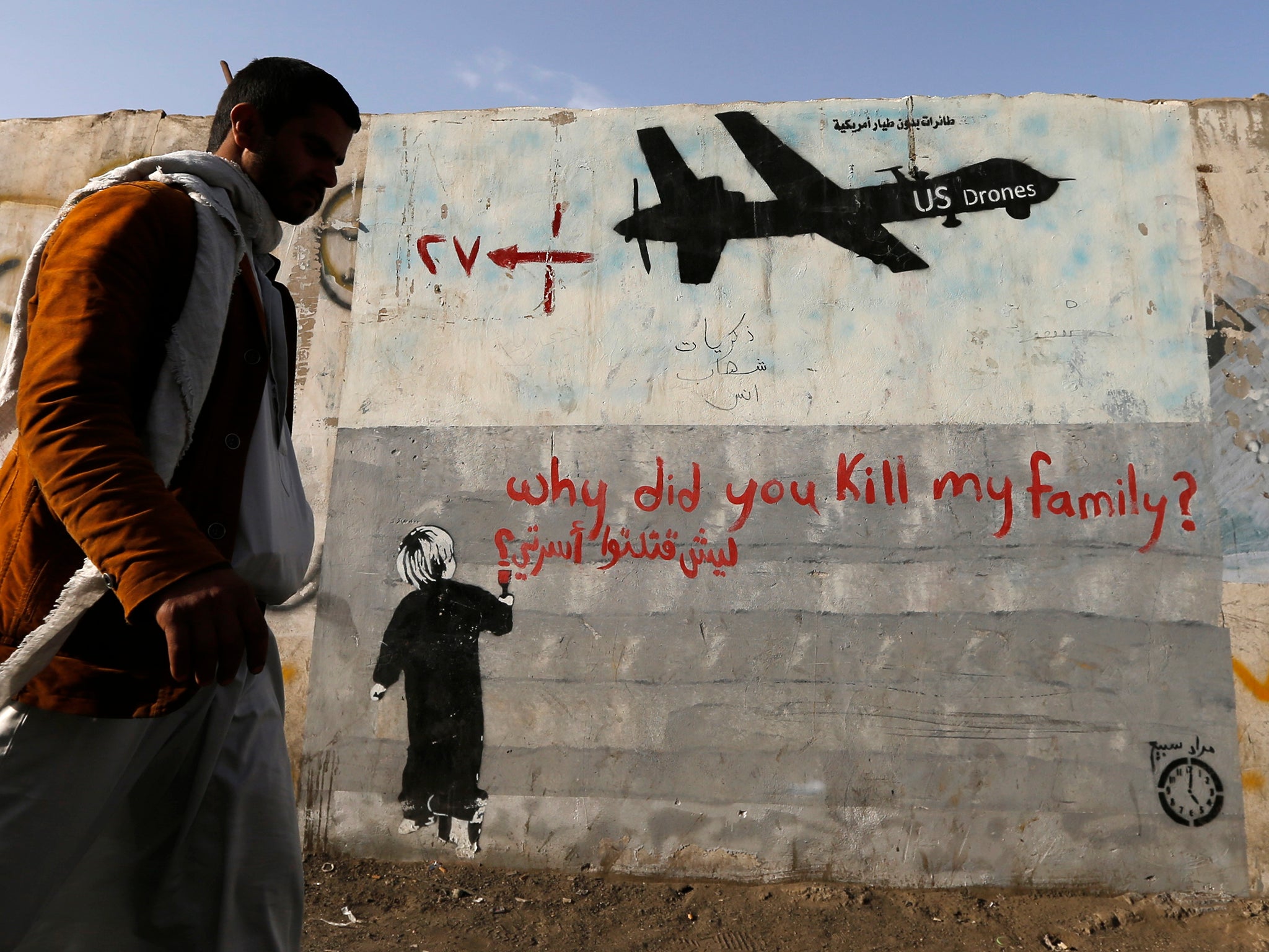 Graffiti denouncing strikes by US drones in Yemen, painted on a wall in Sanaa in 2014