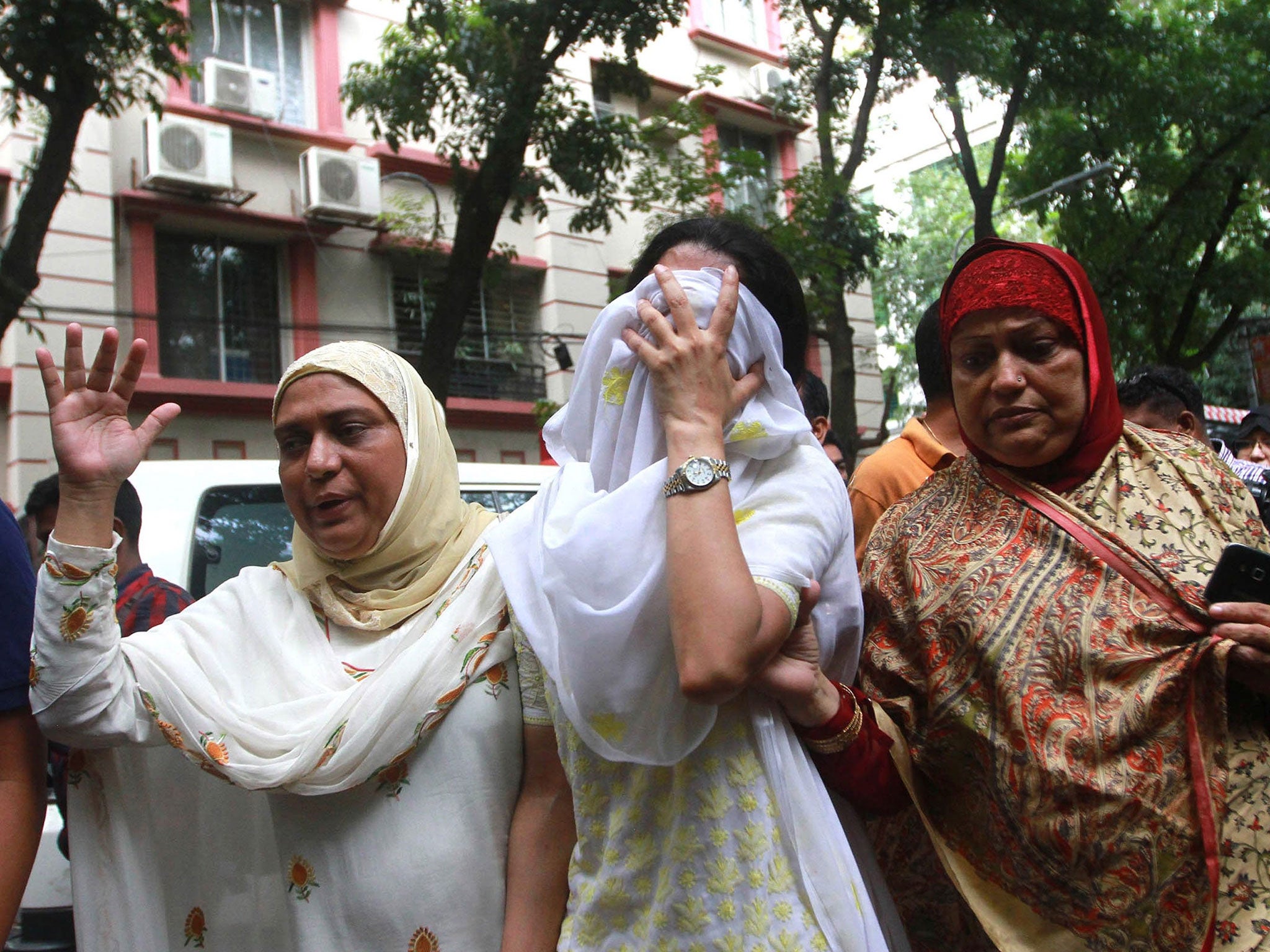 Relatives of the Dhaka terrorists attack victims mourn as they go to identify bodies from the Holey Artisan Bakery in Dhaka, Bangladesh