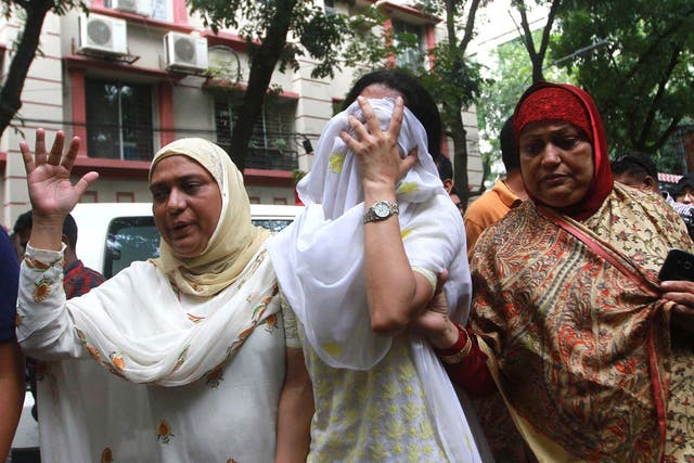 Relatives of the Dhaka terrorists attack victims mourn as they go to identify bodies from the Holey Artisan Bakery in Dhaka, Bangladesh