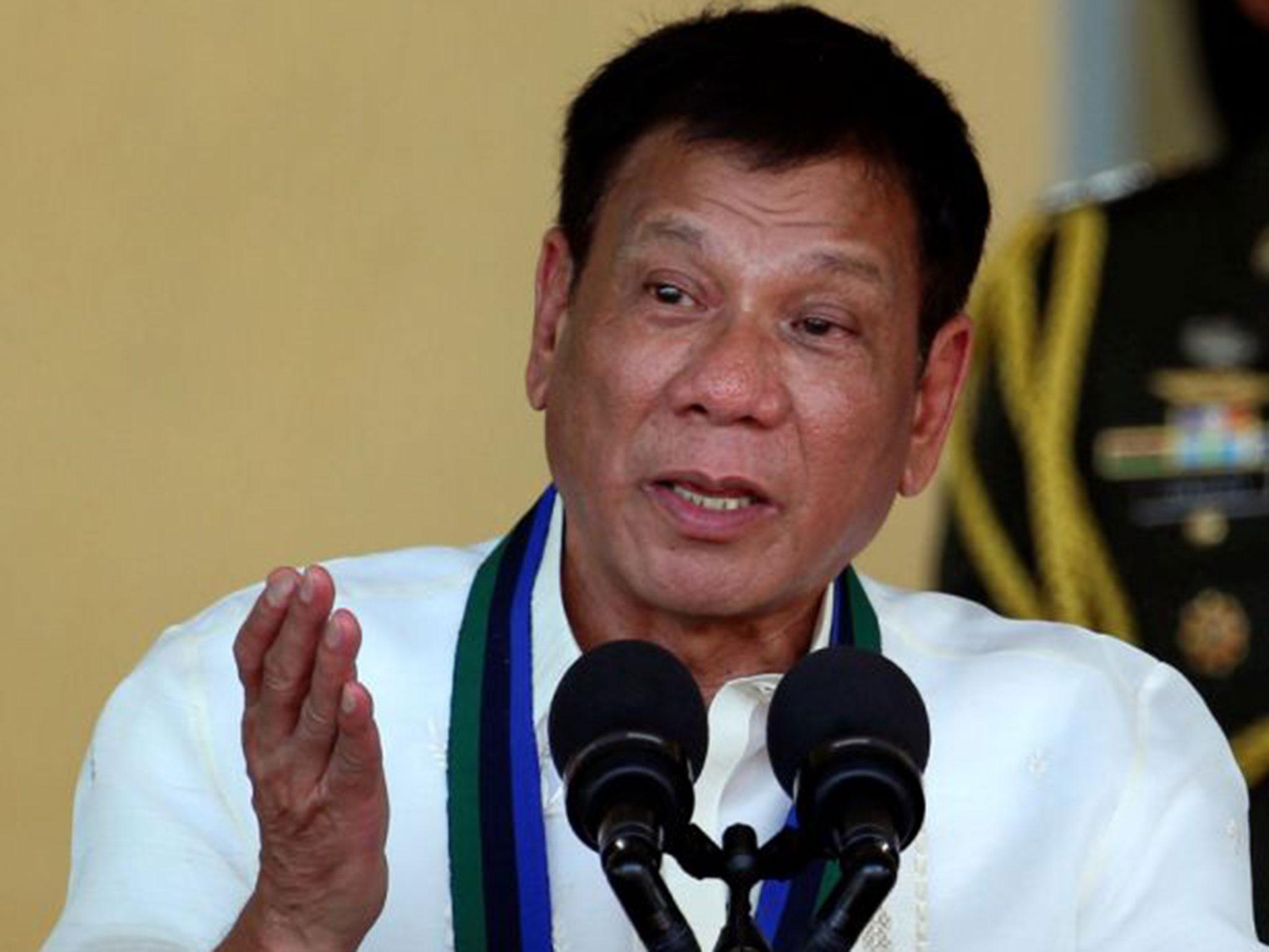 Philippines President Rodrigo Duterte speaks in front of soldiers