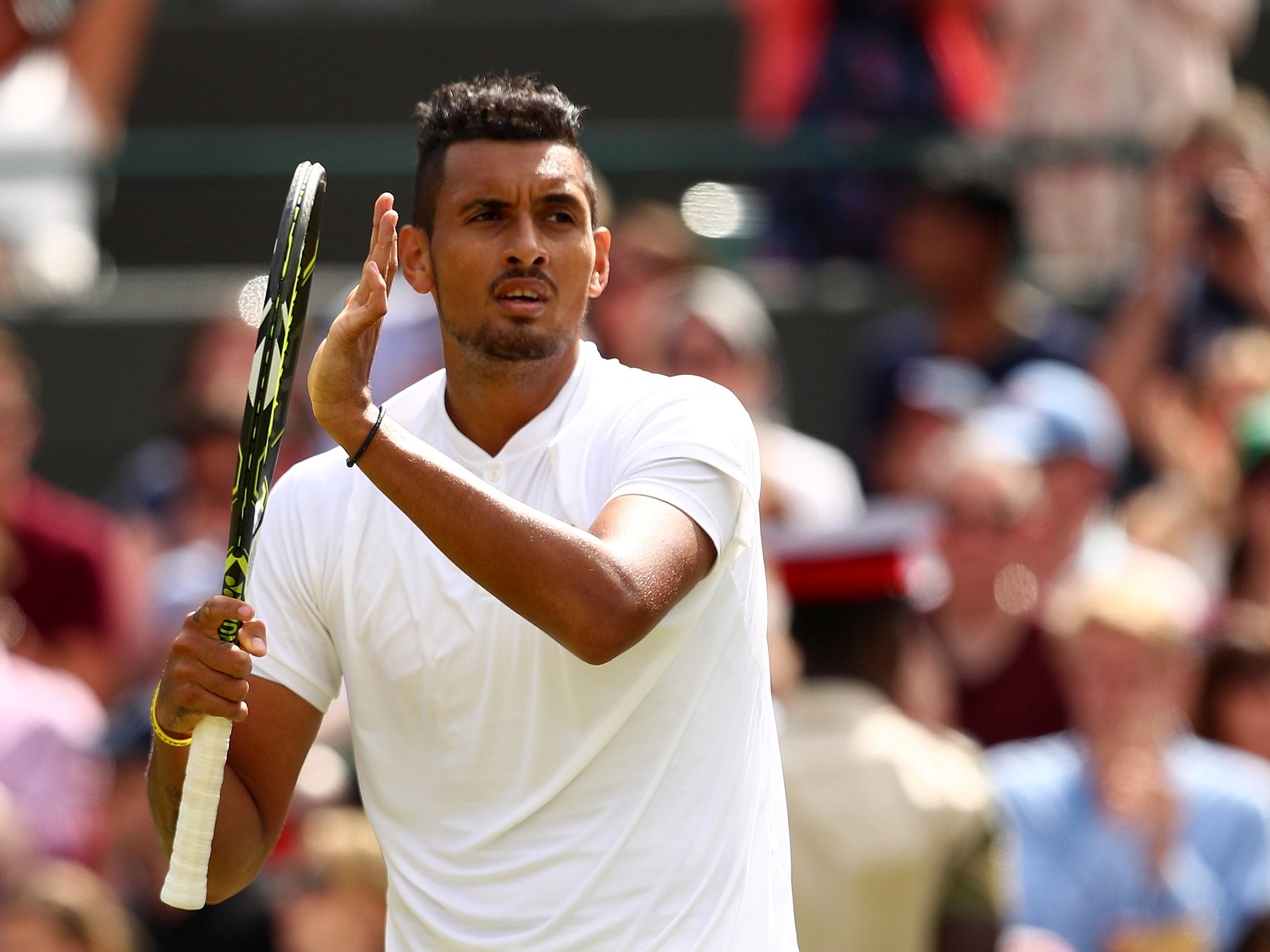 Nick Kyrgios applauds the crowd after beating Feliciano Lopez at Wimbledon