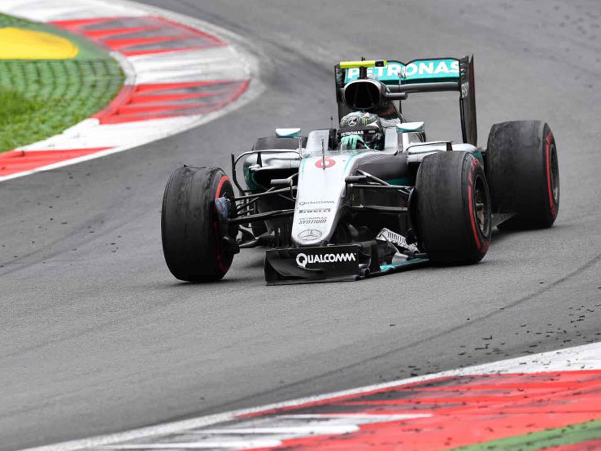 Nico Rosberg limps round on the final lap of the Austrian Grand Prix after crashing with Lewis Hamilton