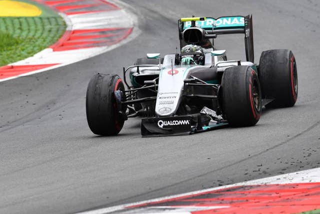 Nico Rosberg limps round on the final lap of the Austrian Grand Prix after crashing with Lewis Hamilton