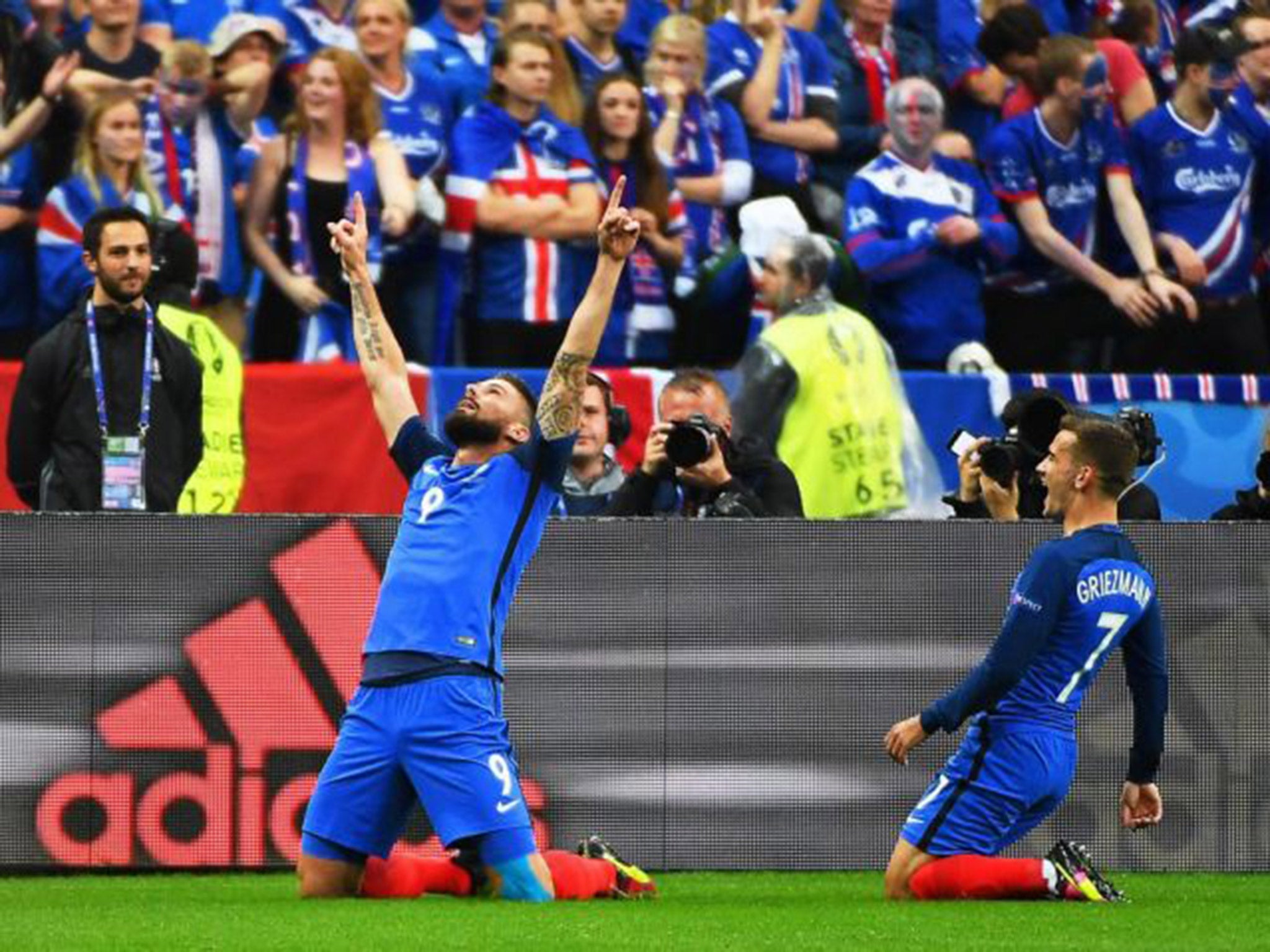 Olivier Giroud celebrates with Antoine Griezmann after opening the scoring for France against Iceland on Sunday night