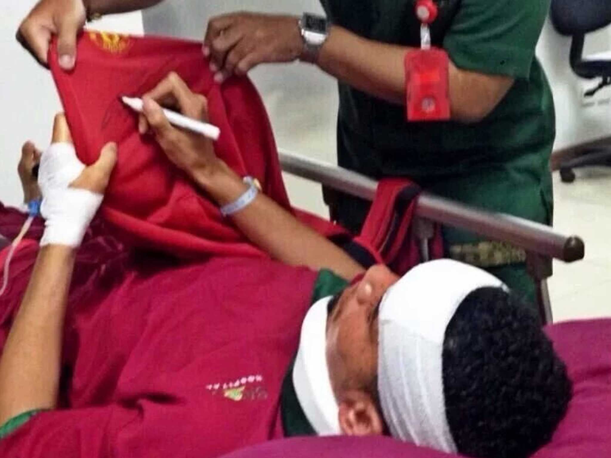 Chris Smalling, it is alleged, is pictured with a neck brace on and a bandage around his head