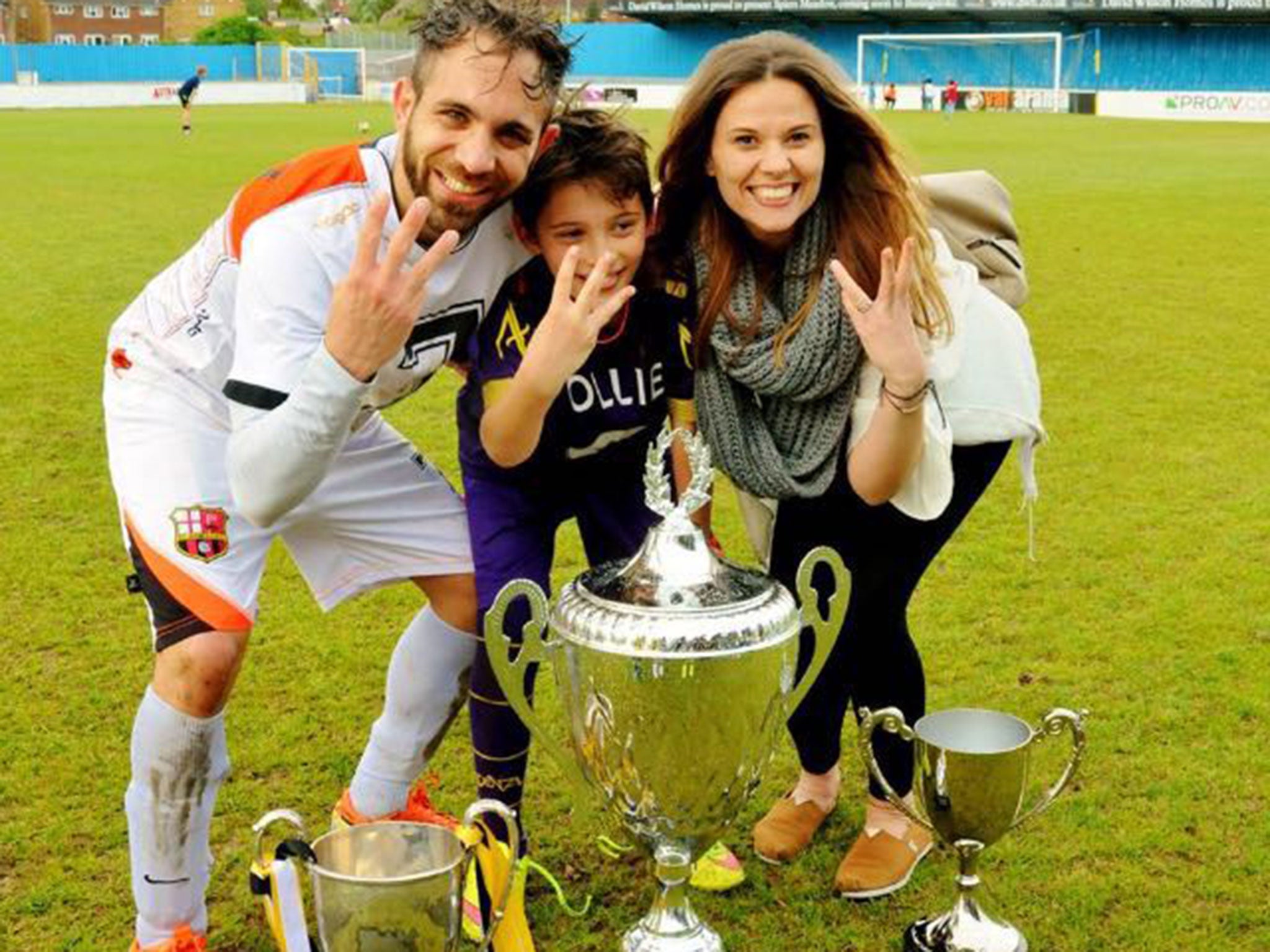 Marios celebrating a treble win in 2015 with Ollie and Tina