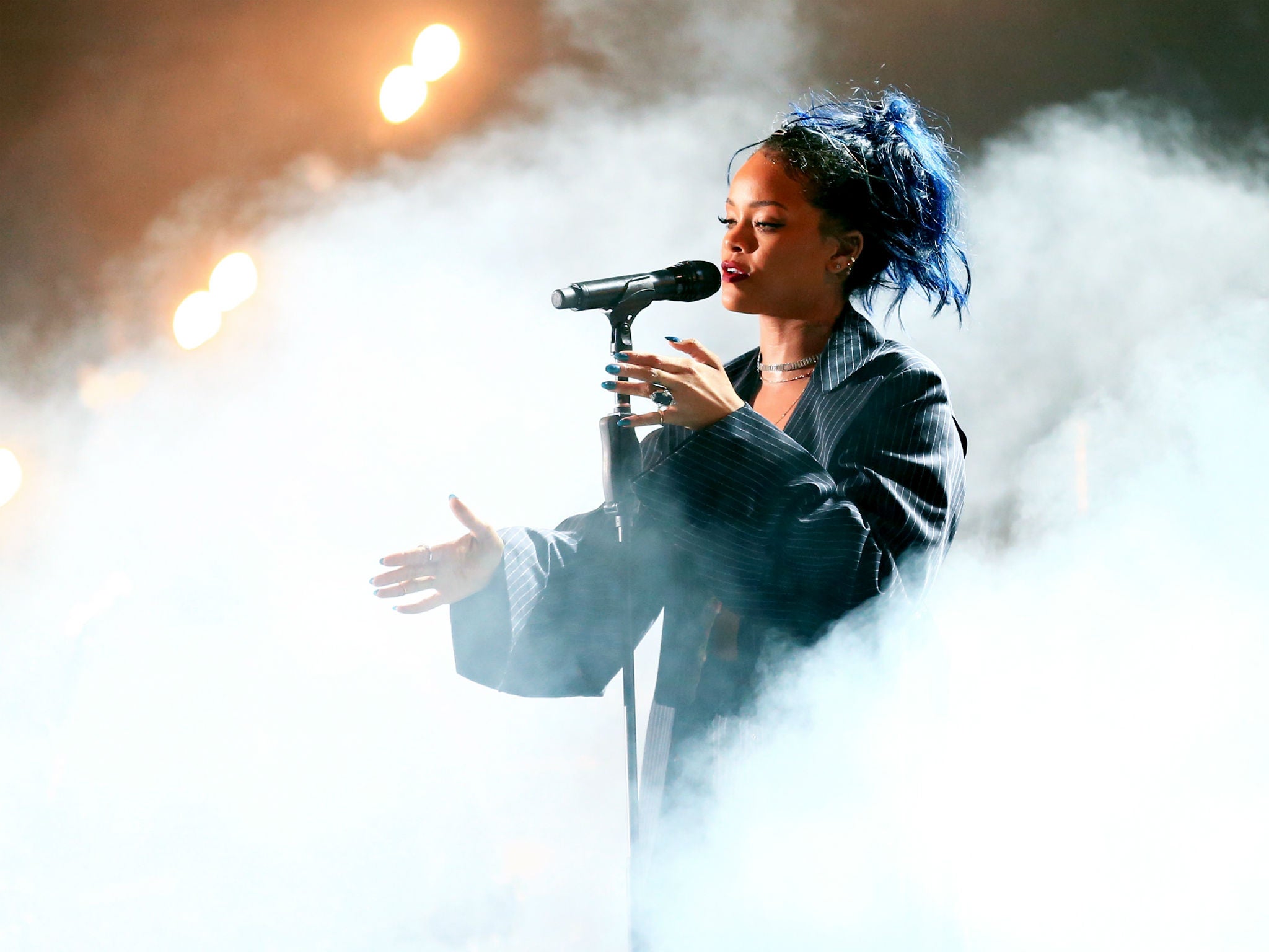 Trust Rihanna to make it rain just in time for a mass sing-a-long of 'Umbrella'