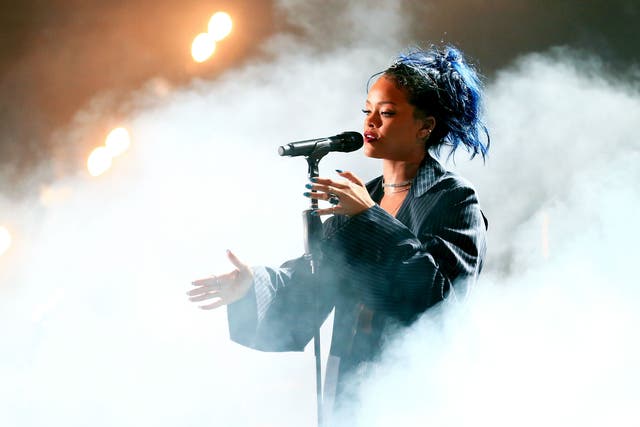 Trust Rihanna to make it rain just in time for a mass sing-a-long of 'Umbrella'