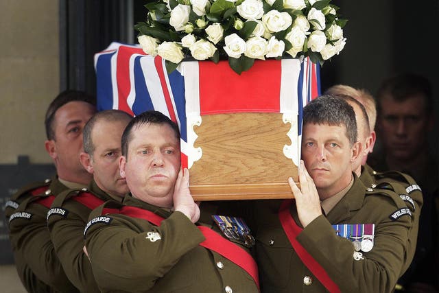 A coffin bearing the body of Britain's Lieutenant Colonel Rupert Thorneloe, of the 1st Battalion the Welsh Guards, is carried out of the Guards Chapel, in London, on July 16, 2009, after a funeral service.