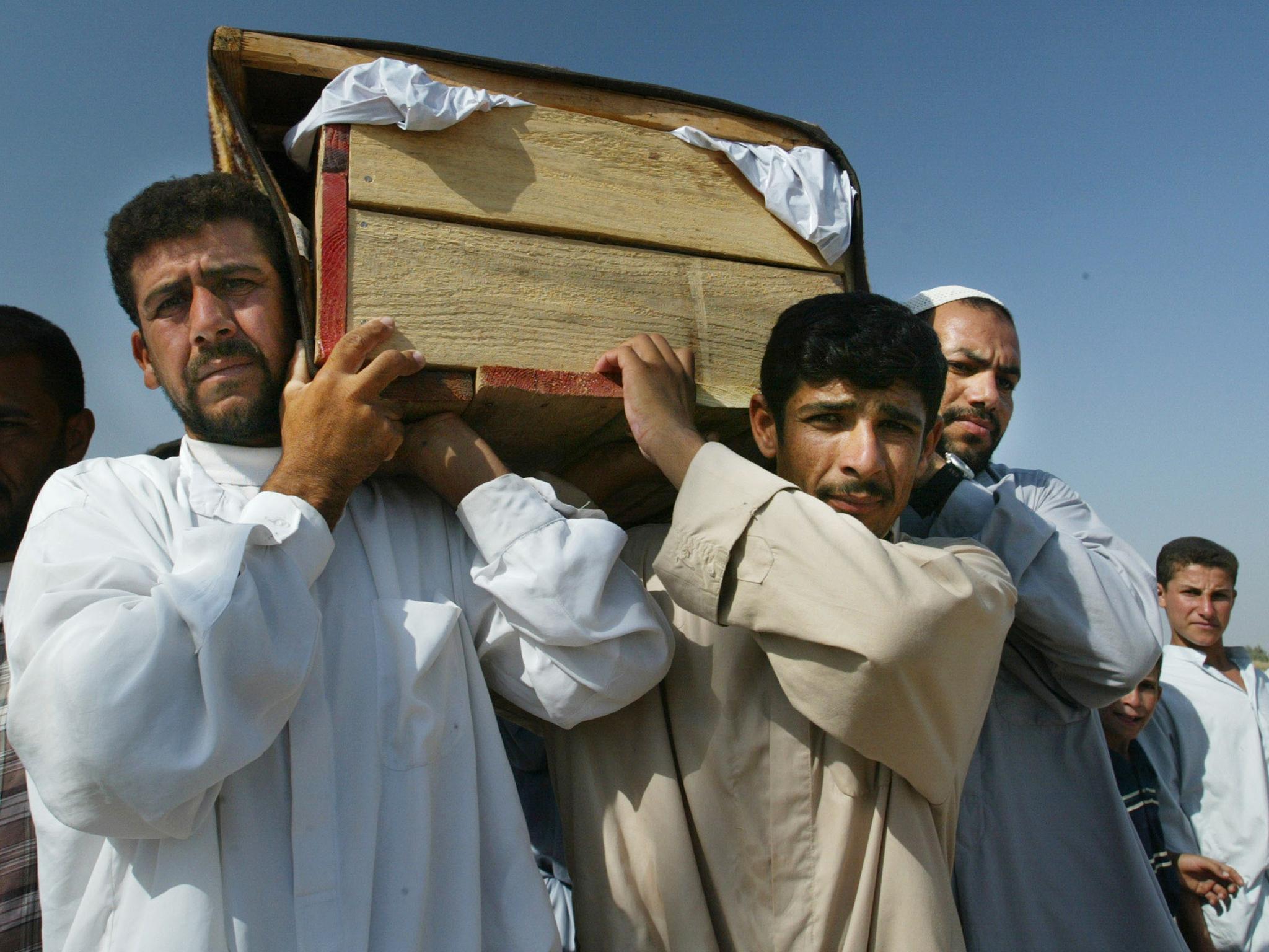 &#13;
Iraqi relatives carry the body of two family members, Zamil Jemeel and his wife Amel Dhary after a shooting incident at a roadblock on September 27, 2003 in Zedan, Iraq. US soldiers fired at on a vehicle during the night on September 26 at a roadblock in Fallujah. &#13;