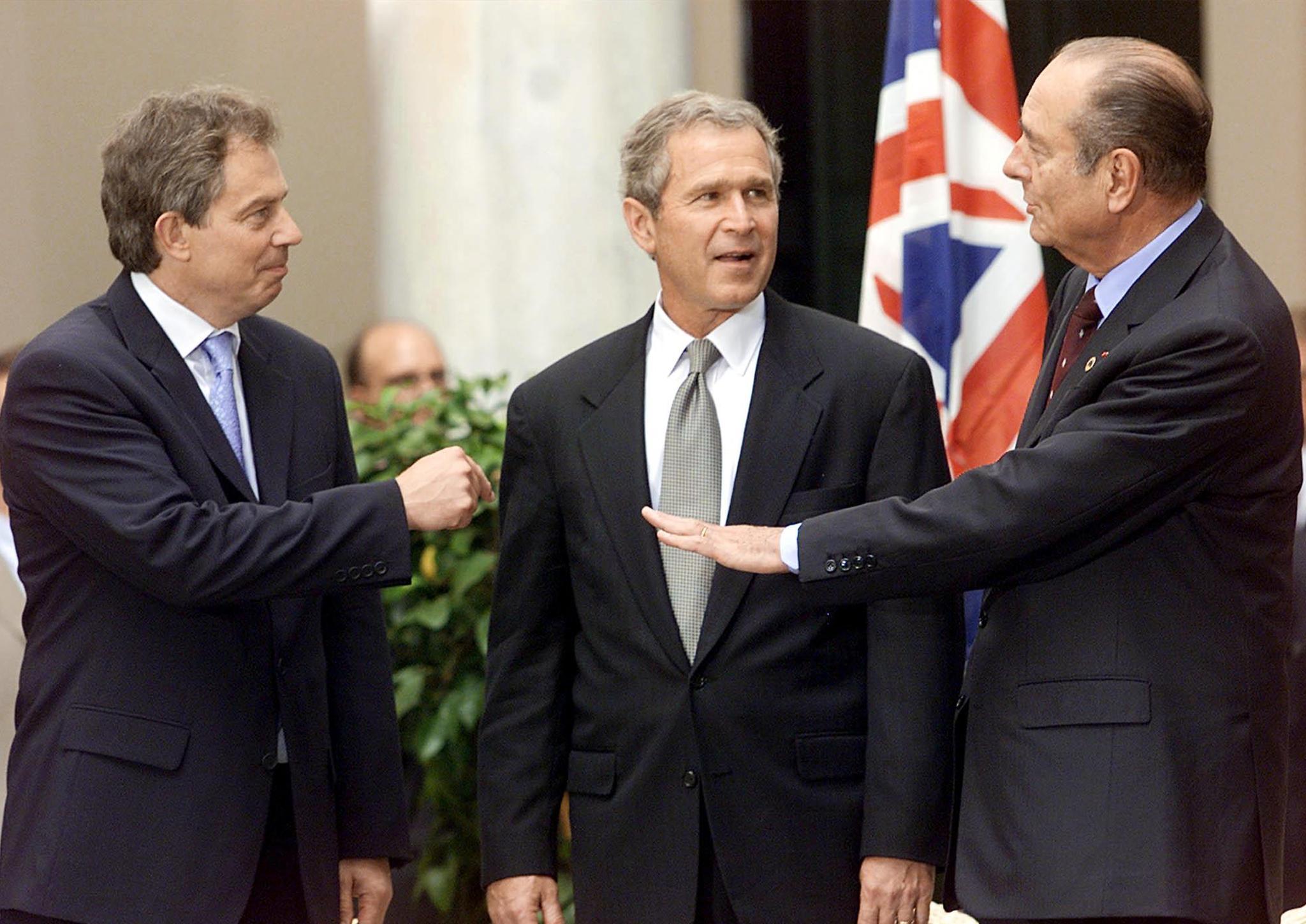 Jacques Chirac, George W Bush and Tony Blair talk on 20 July, 2001 in Genoa, Italy (STEPHEN JAFFE/AFP/Getty Images)