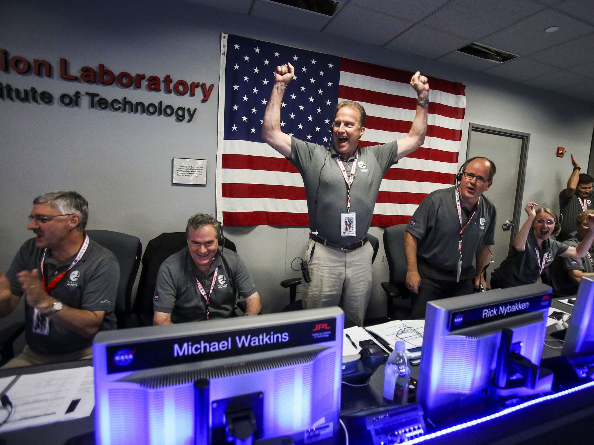 Scientists celebrate in Mission Control at NASA’s Jet Propulsion Laboratory as the solar-powered Juno spacecraft goes into orbit around Jupiter