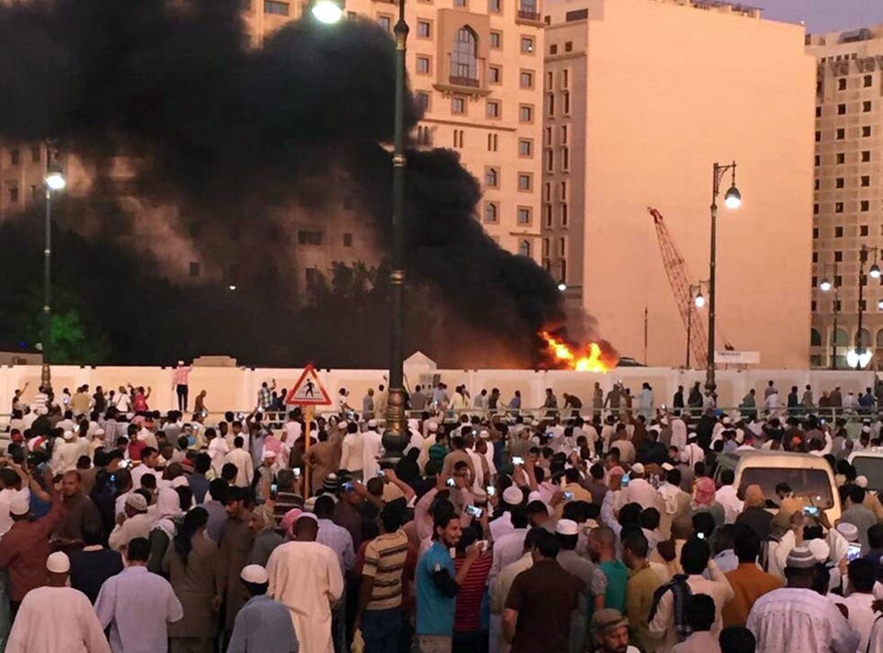 A fire following a bombing close to the Prophet Mohamed Mosque in the holy city of Medina, in Saudi Arabia, on 4 July