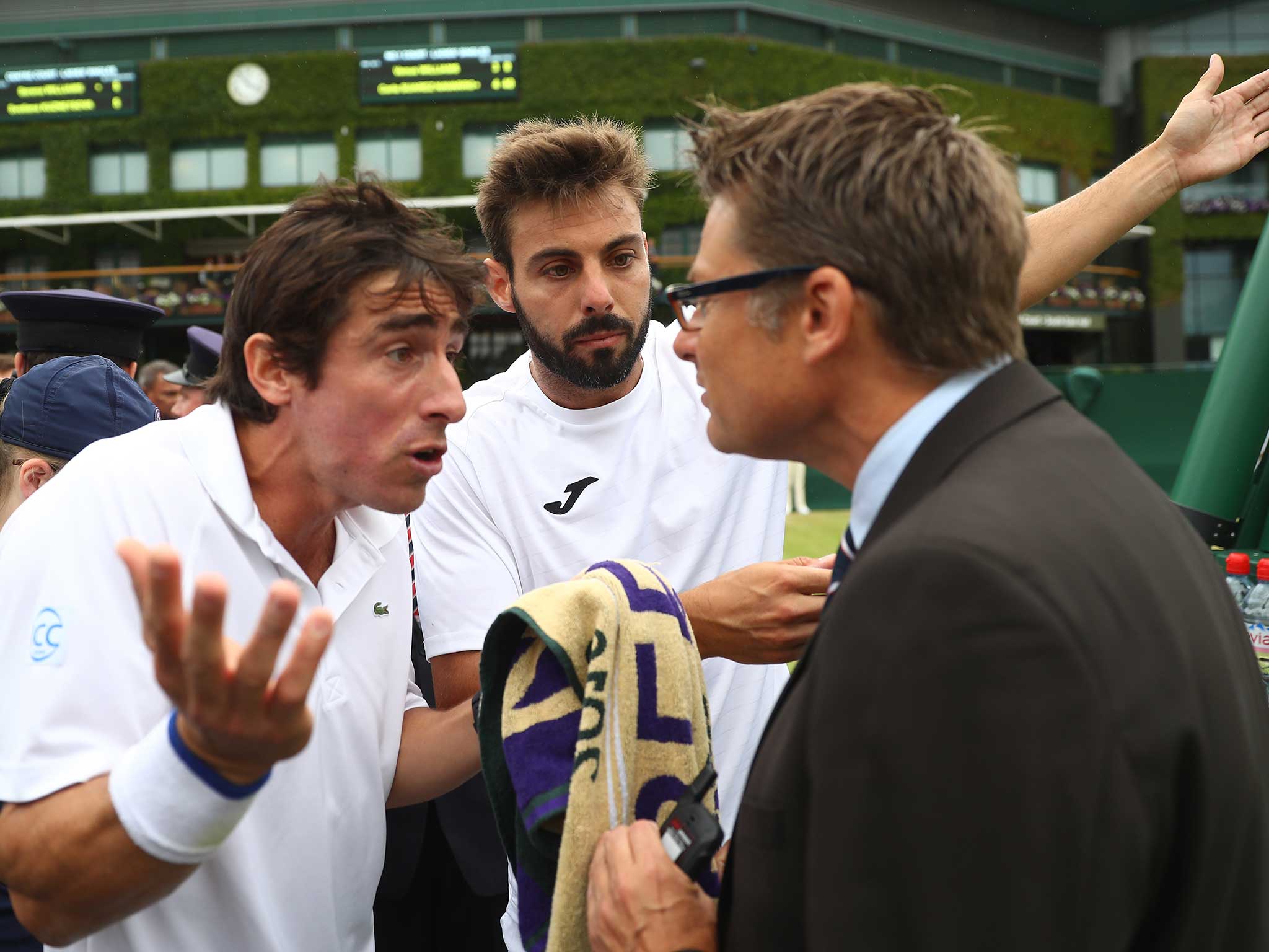 Pablo Cuevas pleads with the umpire at Wimbledon over a toilet break