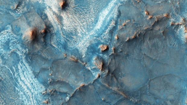 The Nili Fossae region, one of the most colourful regions on Mars. Before it lost its atmosphere, Mars likely had large bodies of water (Nasa)