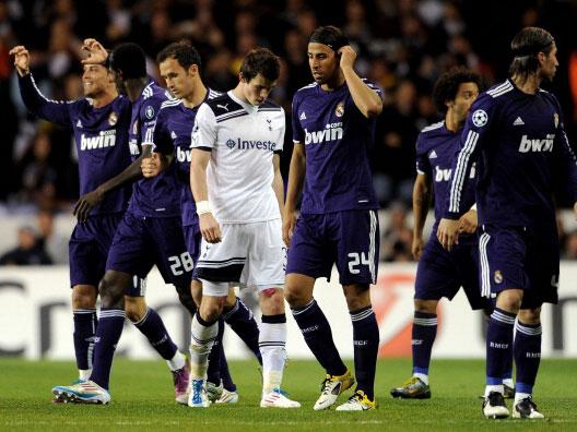 Gareth Bale is dejected as Cristiano Ronaldo is congratulated on his goal at White Hart Lane (Getty)