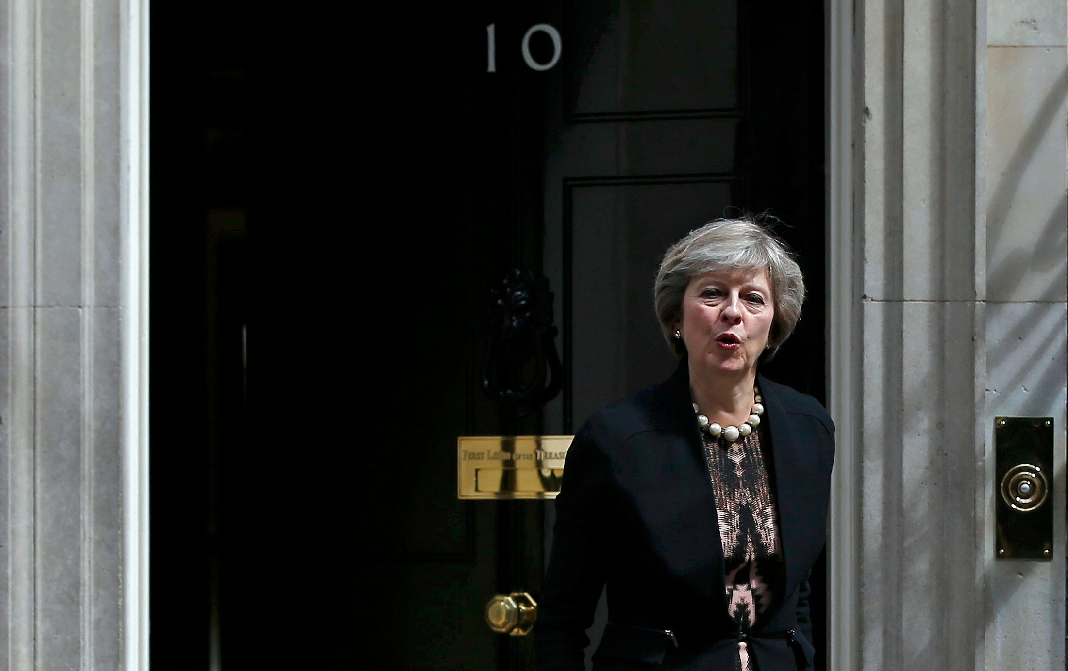 Theresa May leaves after attending a cabinet meeting at Number 10