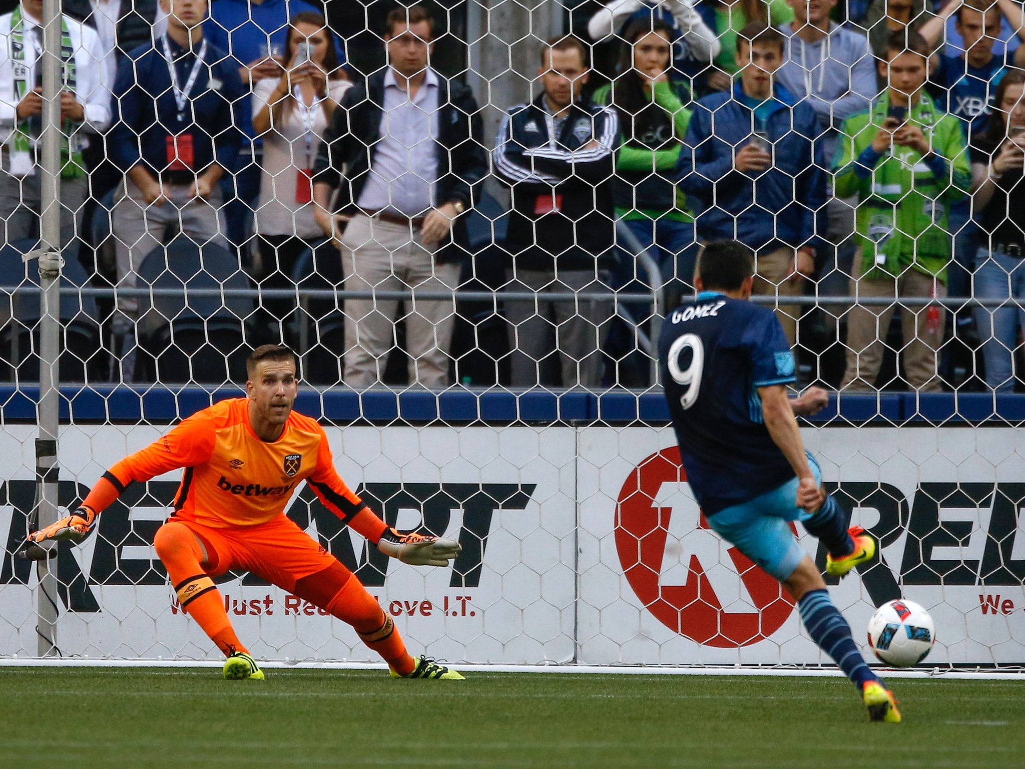 Herculez Gomez scores a penalty past West Ham goalkeeper Adrian