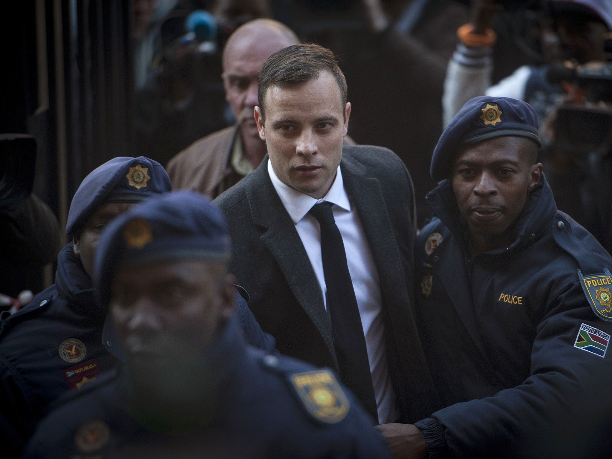 Oscar Pistorius, center, arrives at the High Court in Pretoria, South Africa Wednesday, July 6, 2016