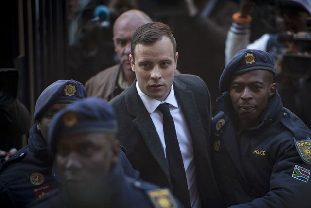 Oscar Pistorius, center, arrives at the High Court in Pretoria, South Africa Wednesday, July 6, 2016