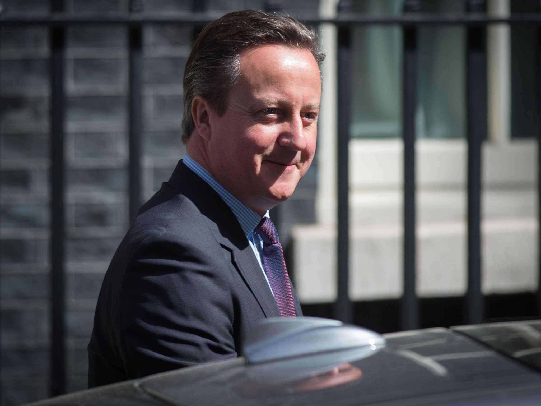 David Cameron leaves 10 Downing Street in London to travel to the House of Commons