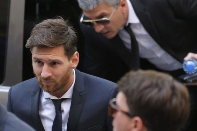 Lionel Messi arrives at a Spanish court in Barcelona to answer charges of tax fraud