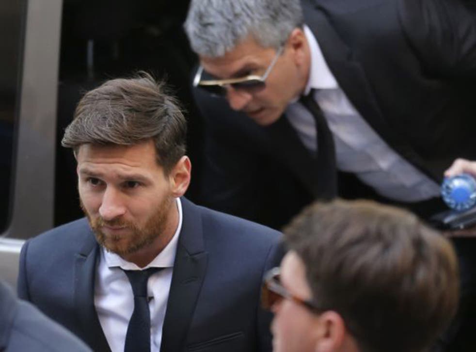 Lionel Messi arrives at a Spanish court in Barcelona to answer charges of tax fraud