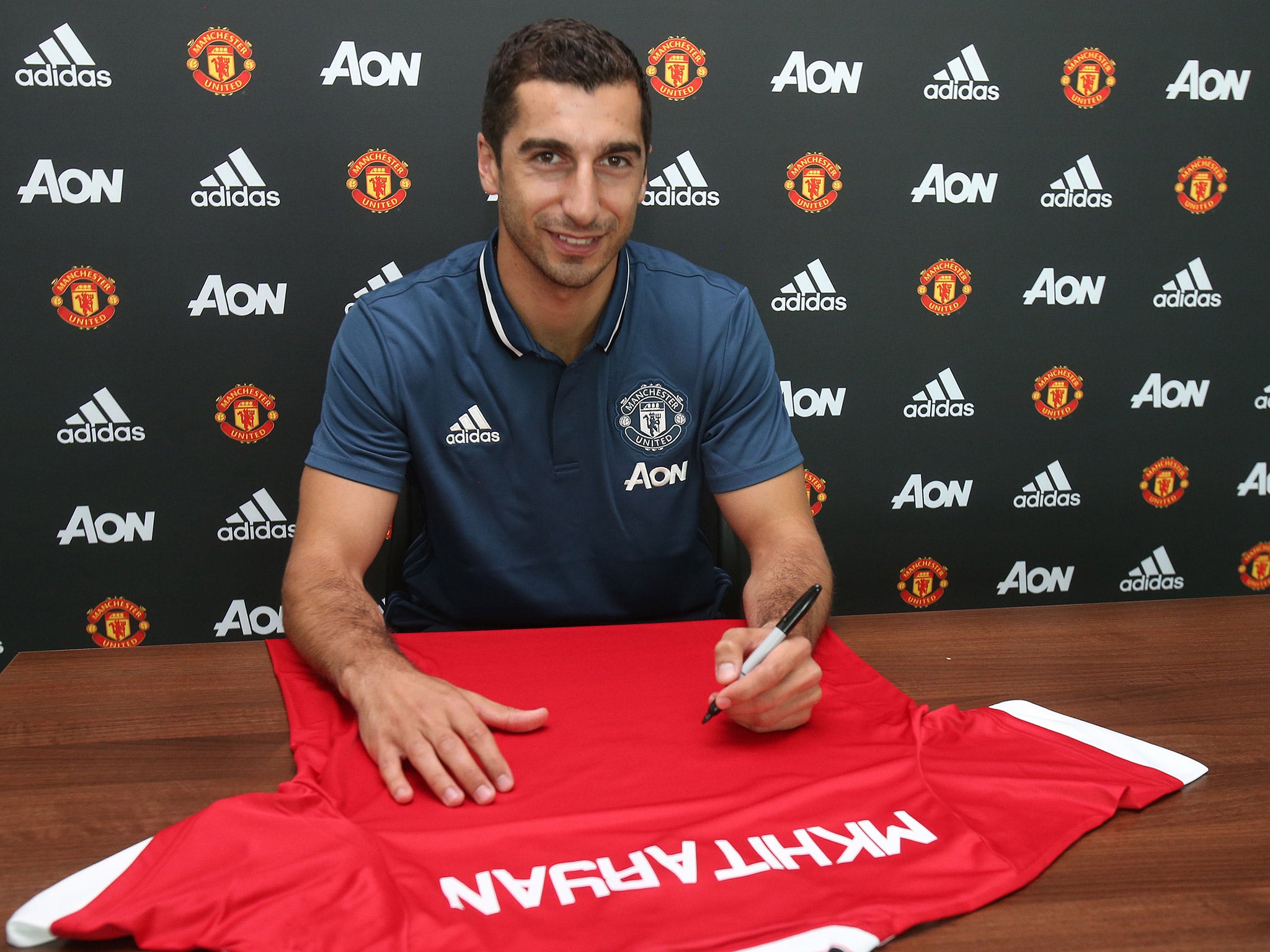 Henrikh Mkhitaryan joins United on a four-year contract