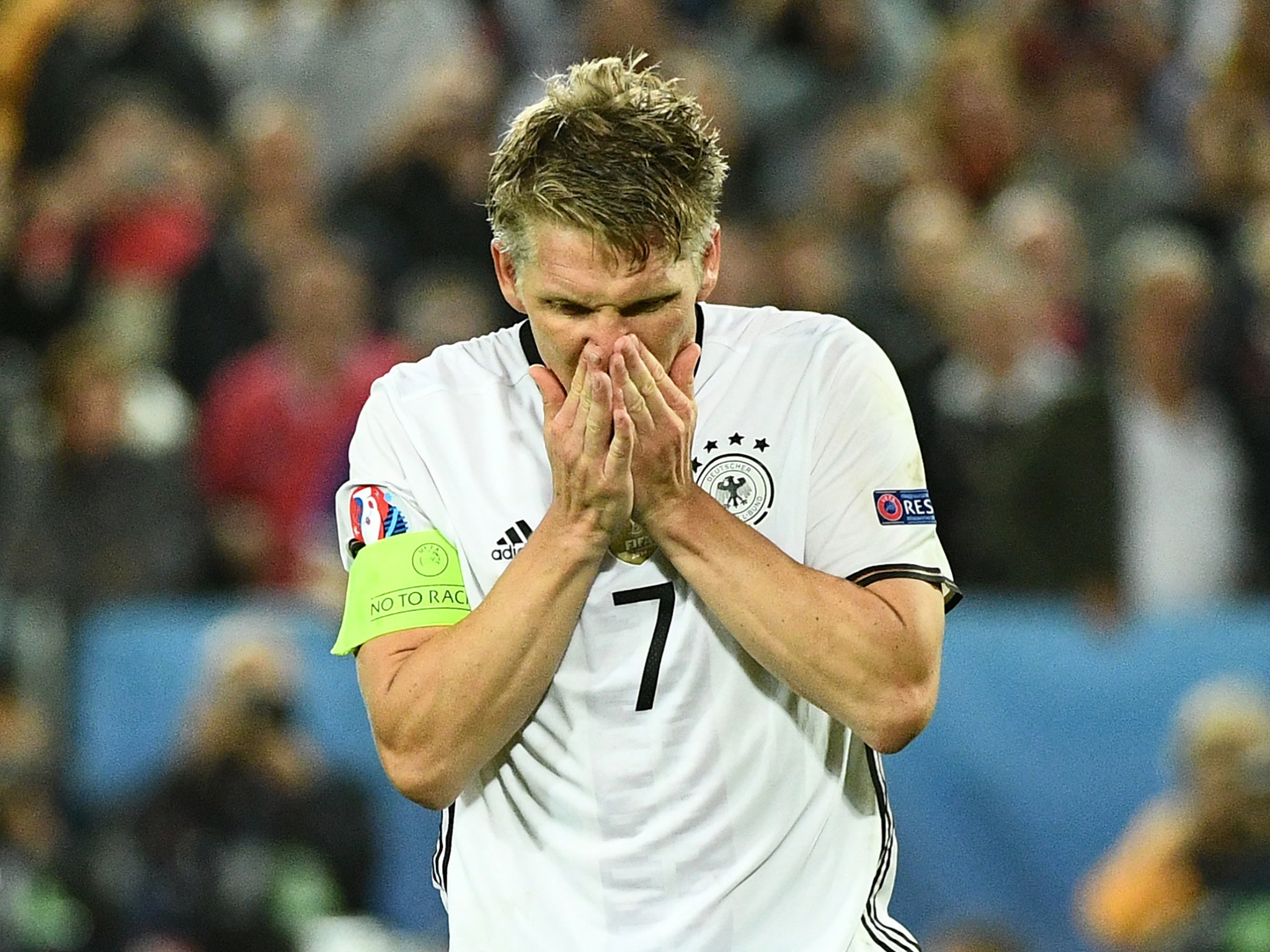 Schweinsteiger reacts after missing in the quarter-final penalty shoot-out against Italy