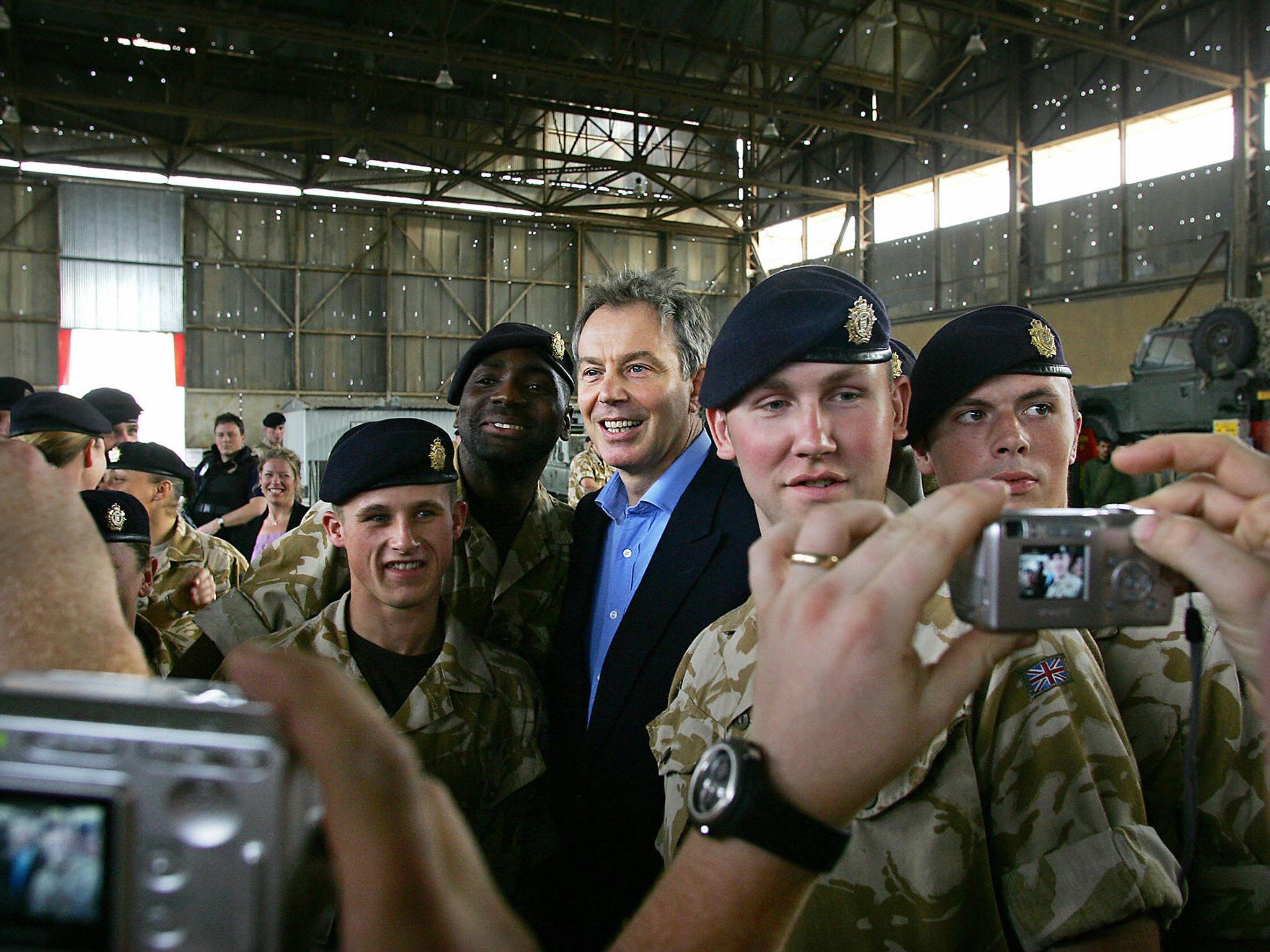 Tony Blair with troops from The Royal Logistics Corps while he visited Shaiba Logistics Base in Basra, 2005