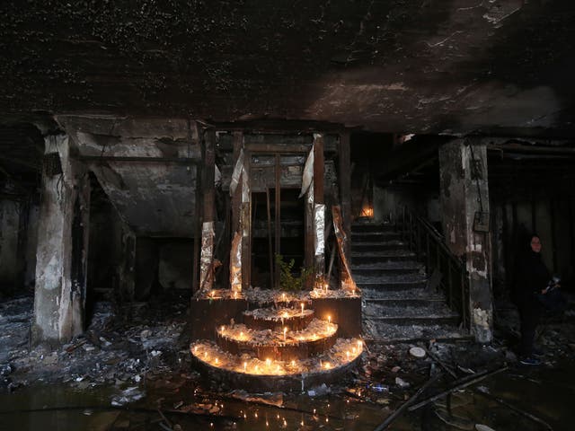 Lit candles sit at the site of a suicide-bombing attack which took 250 lives on July 3 in Baghdad's Karrada neighbourhood