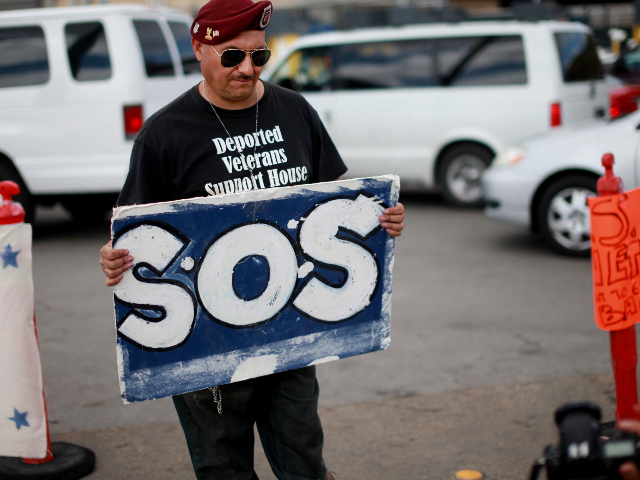 U.S. Army veteran Hector Barajas protests the deportation of military personnel at the Tijuana border Sandy Huffaker/Getty